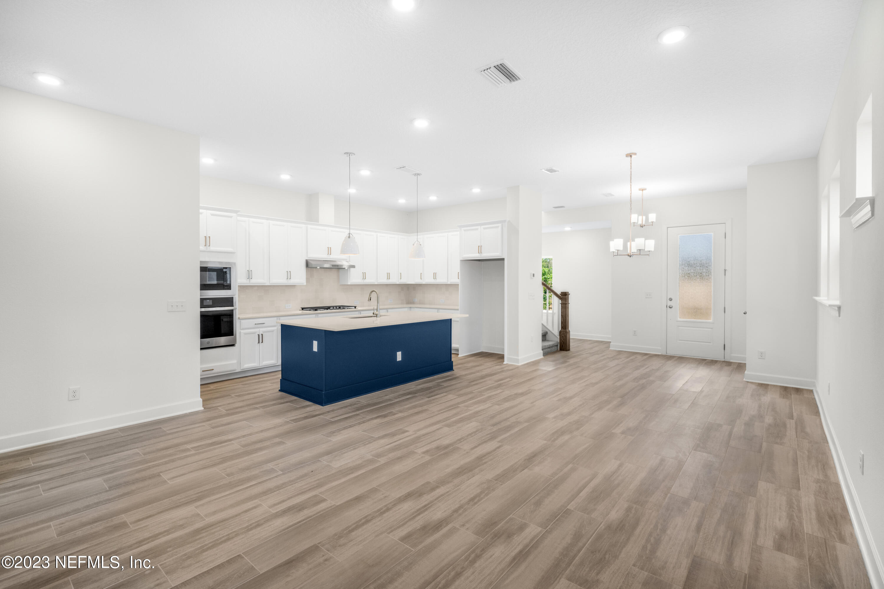 11015 Cosmic Way Jacksonville, FL 32256 - Photo 5 of 9 a view of kitchen and kitchen island wooden floor