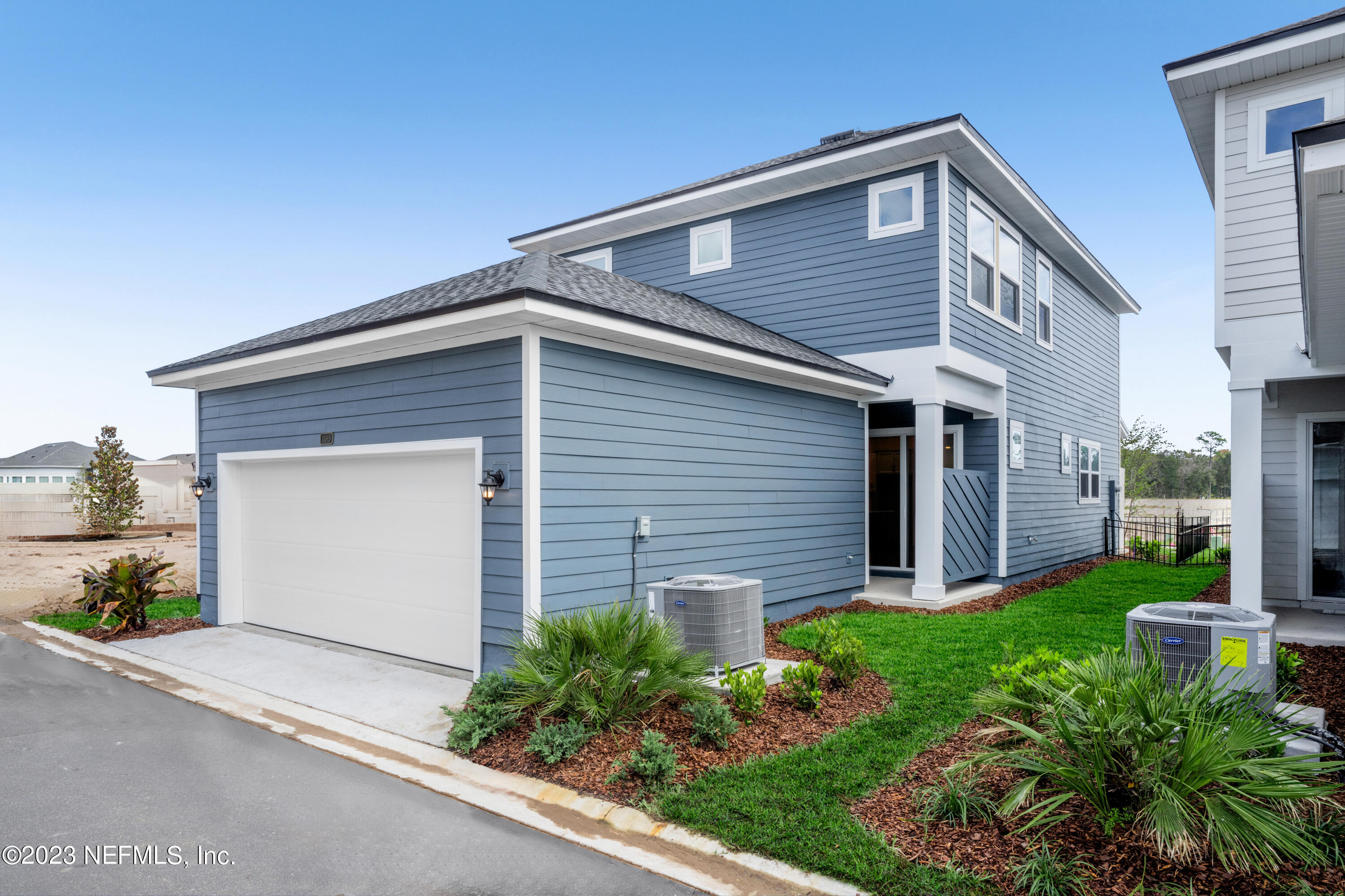 11015 Cosmic Way Jacksonville, FL 32256 - Photo 9 of 9 a front view of house with a garden