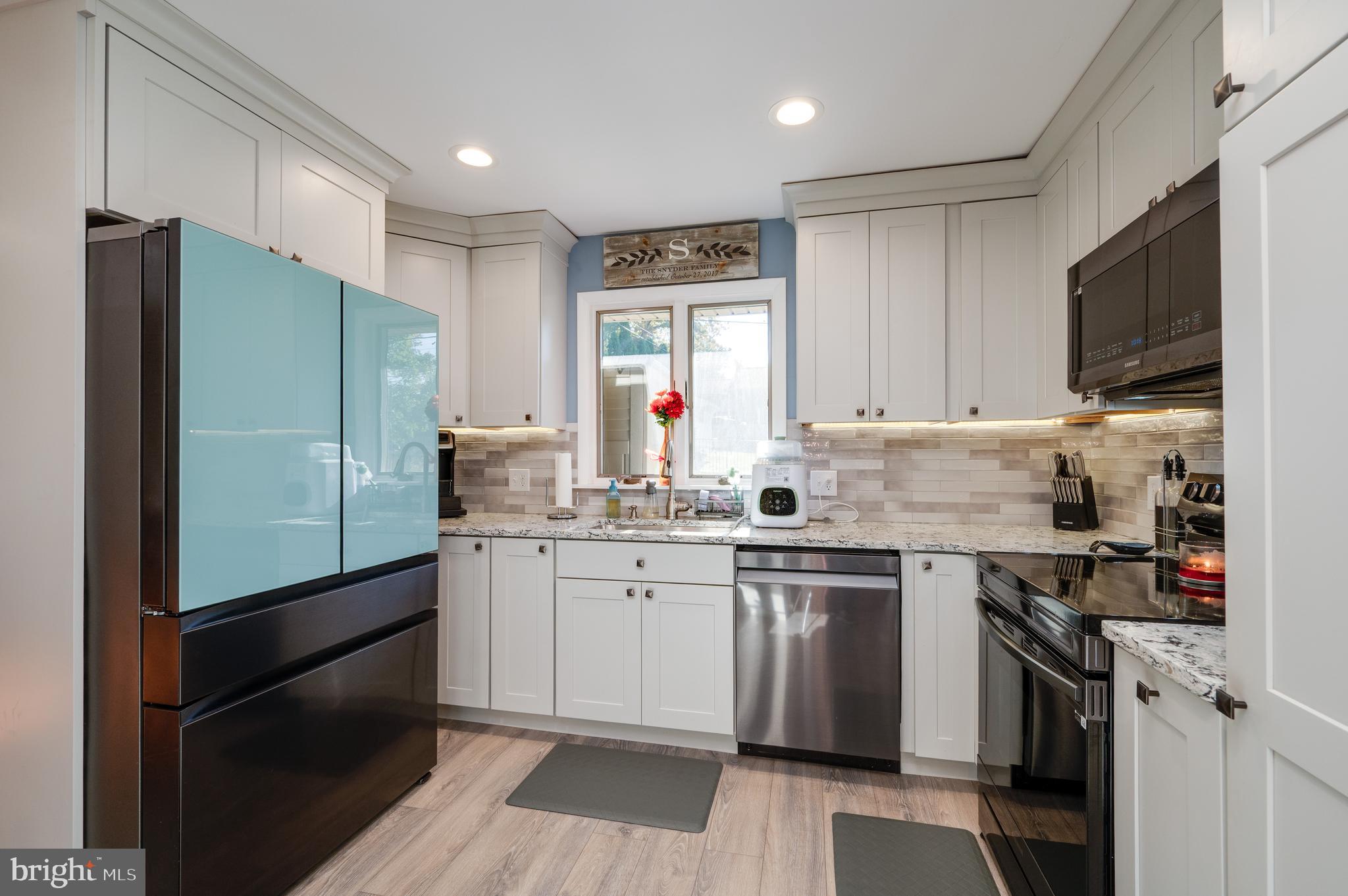 118 Octagon Avenue Sinking Spring, PA 19608 - Photo 16 of 45 a kitchen with granite countertop appliances cabinets and a sink