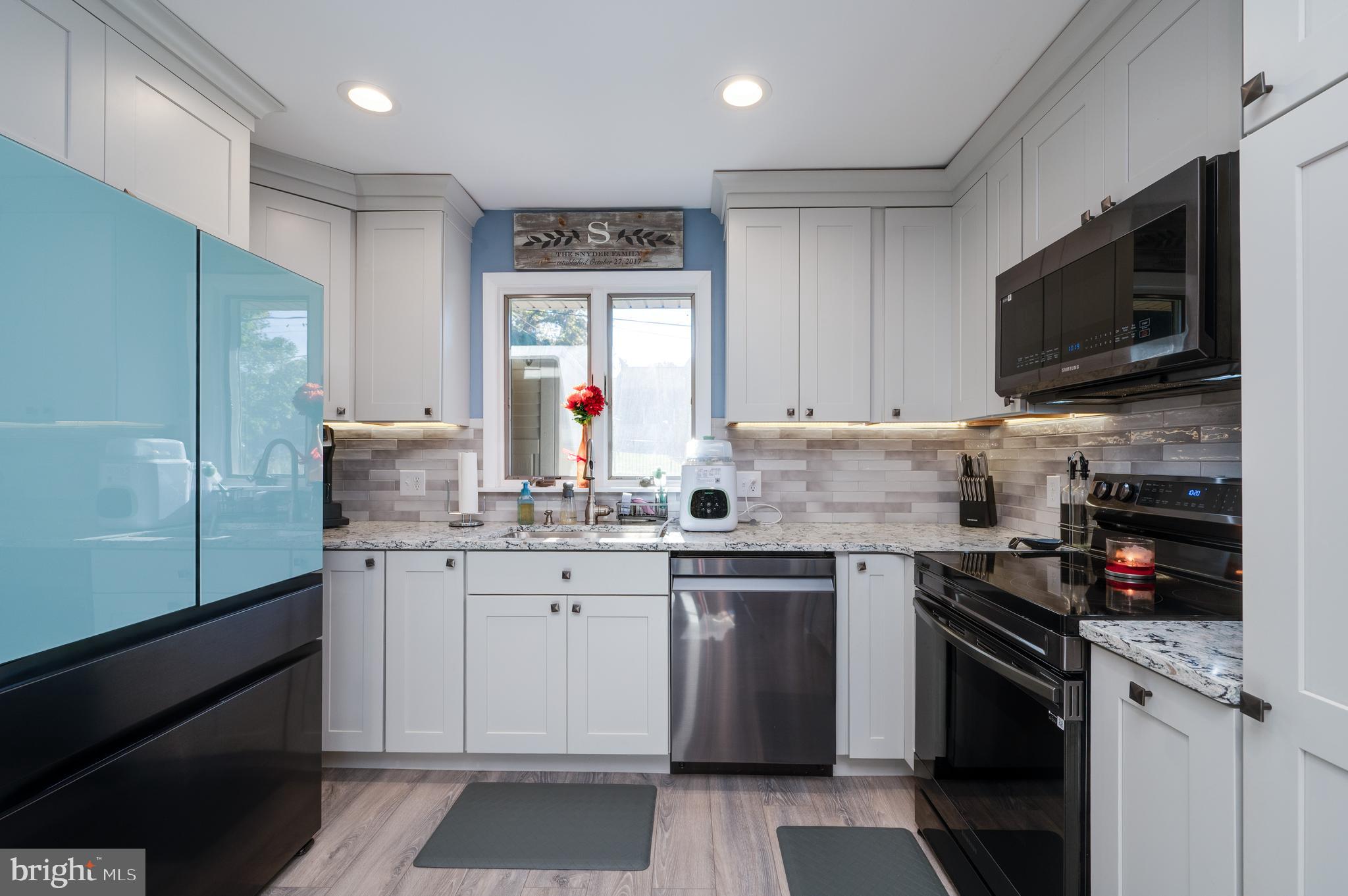 118 Octagon Avenue Sinking Spring, PA 19608 - Photo 17 of 45 a kitchen with a sink stove and microwave