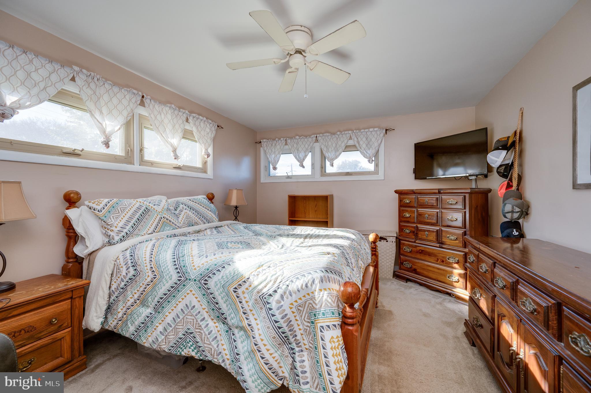 118 Octagon Avenue Sinking Spring, PA 19608 - Photo 23 of 45 a bedroom with a bed and a flat tv screen on the dresser