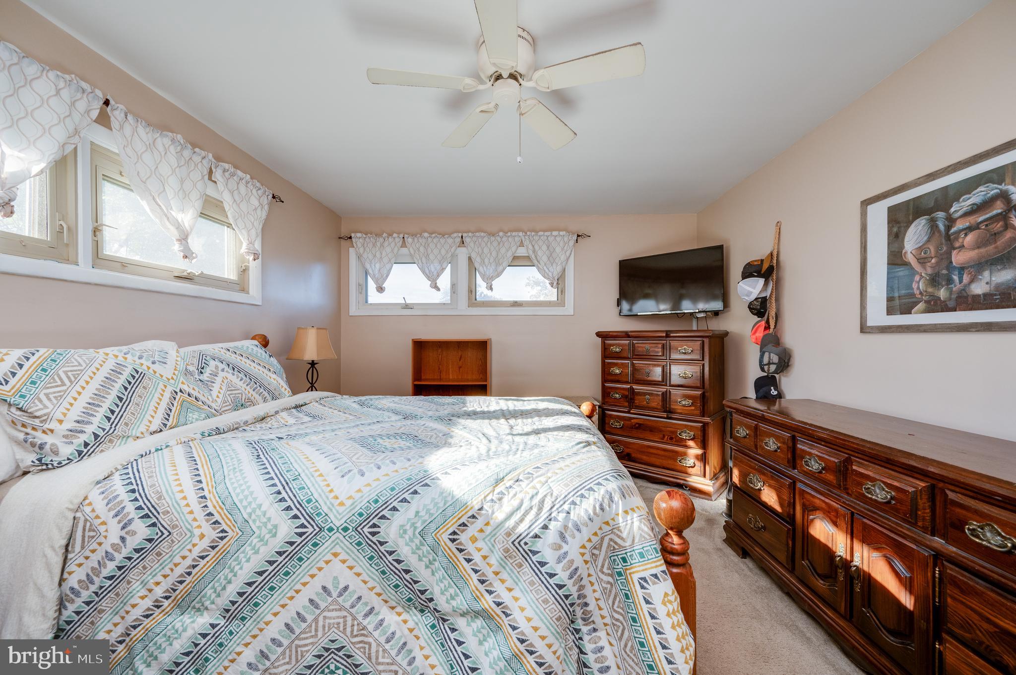 118 Octagon Avenue Sinking Spring, PA 19608 - Photo 24 of 45 a bedroom with a bed and a flat screen tv