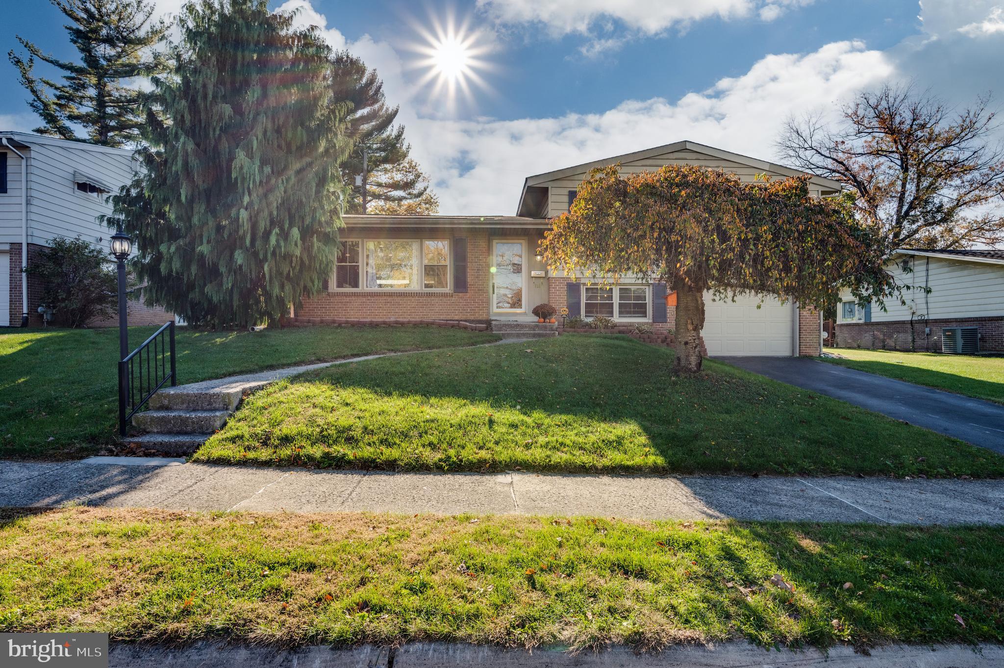 118 Octagon Avenue Sinking Spring, PA 19608 - Photo 39 of 45 a view of a white house with a yard and plants