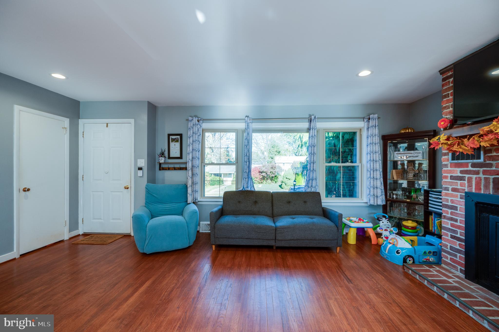 118 Octagon Avenue Sinking Spring, PA 19608 - Photo 6 of 45 a living room with furniture and a flat screen tv