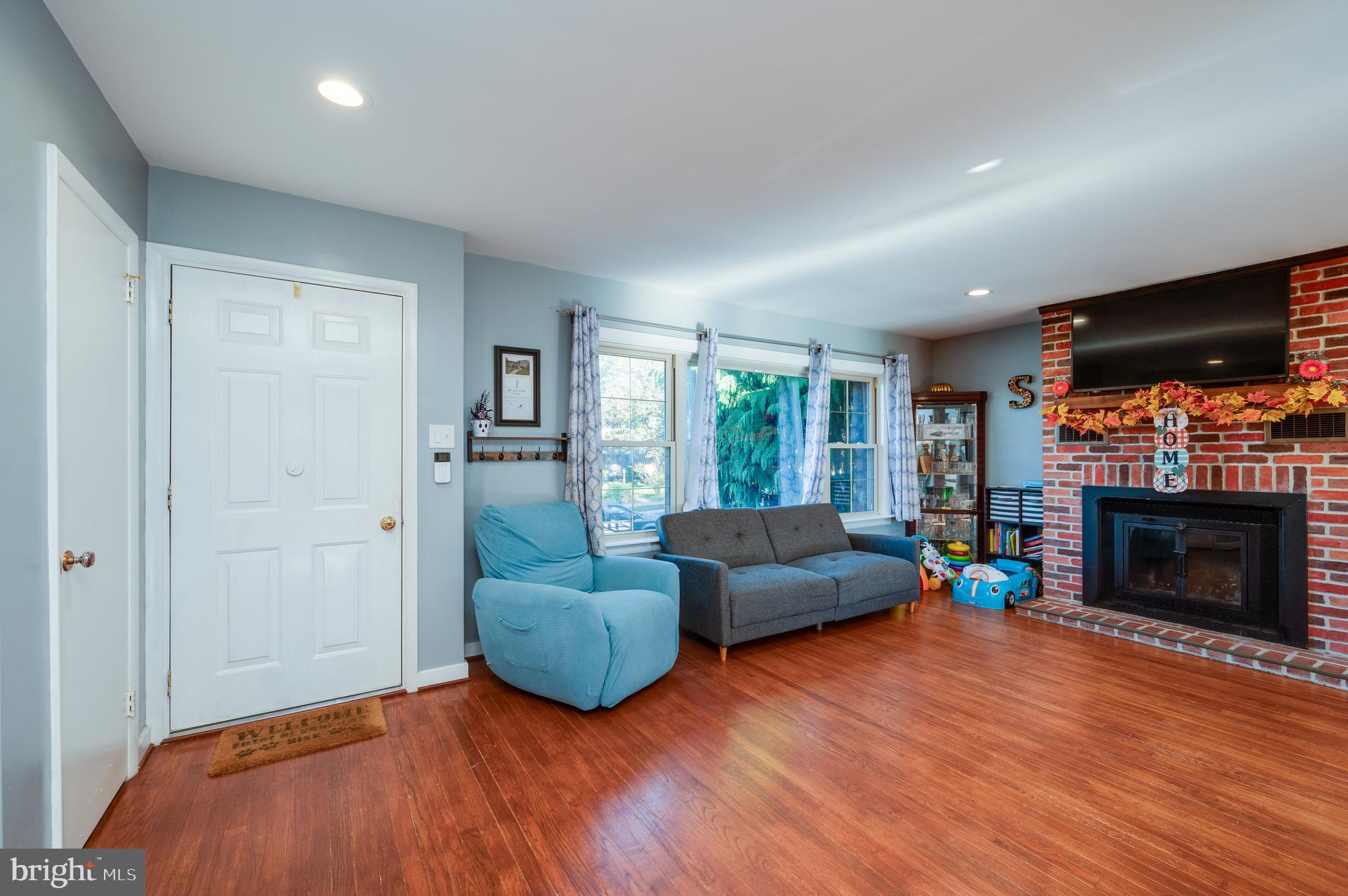 118 Octagon Avenue Sinking Spring, PA 19608 - Photo 7 of 45 a living room with furniture and a fireplace