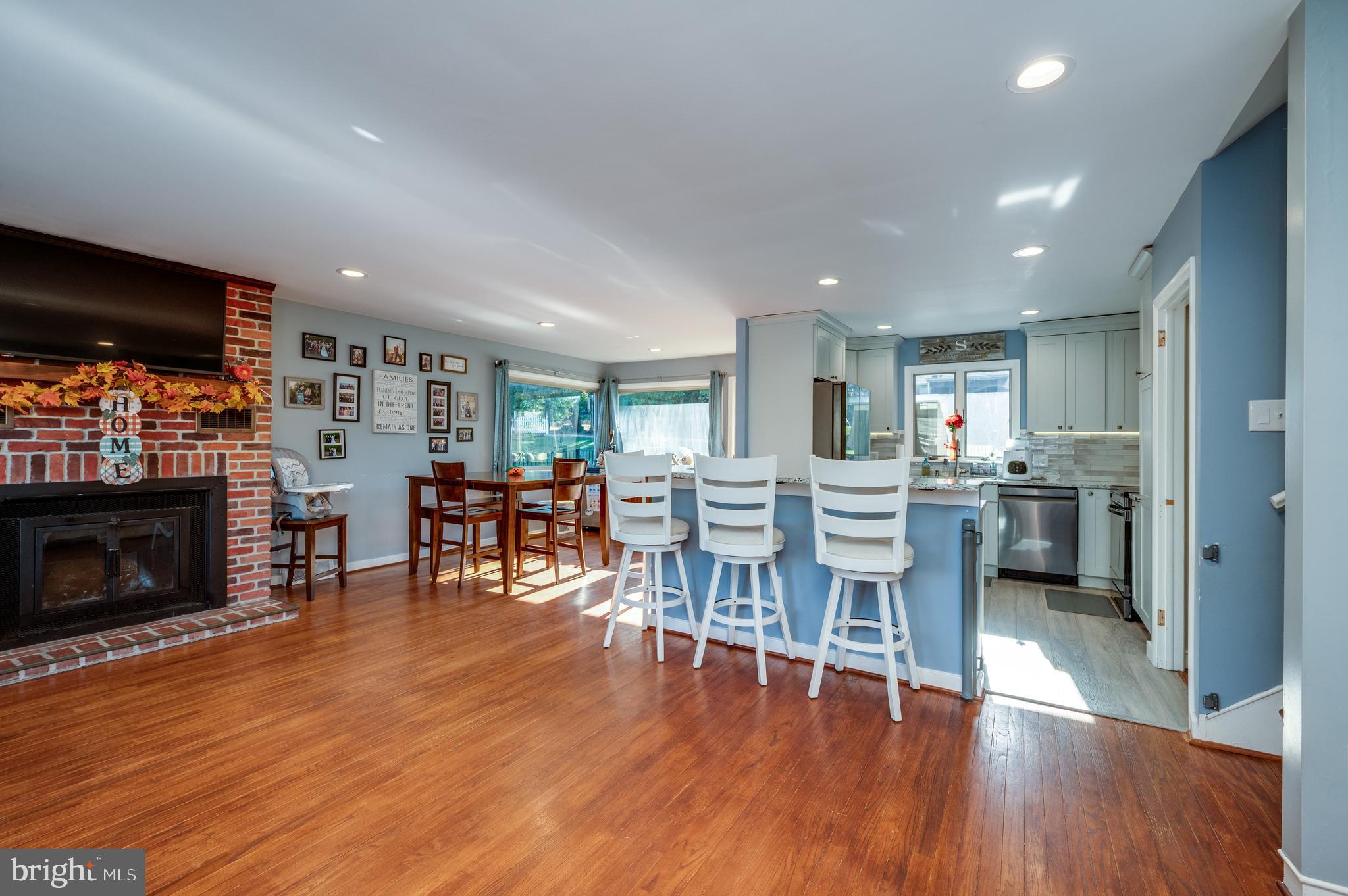 118 Octagon Avenue Sinking Spring, PA 19608 - Photo 8 of 45 a living room with furniture a fireplace and a flat screen tv