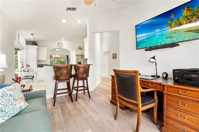 a room with furniture and a flat screen tv