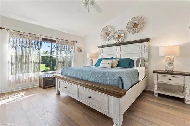 a bedroom with a large bed and a large window