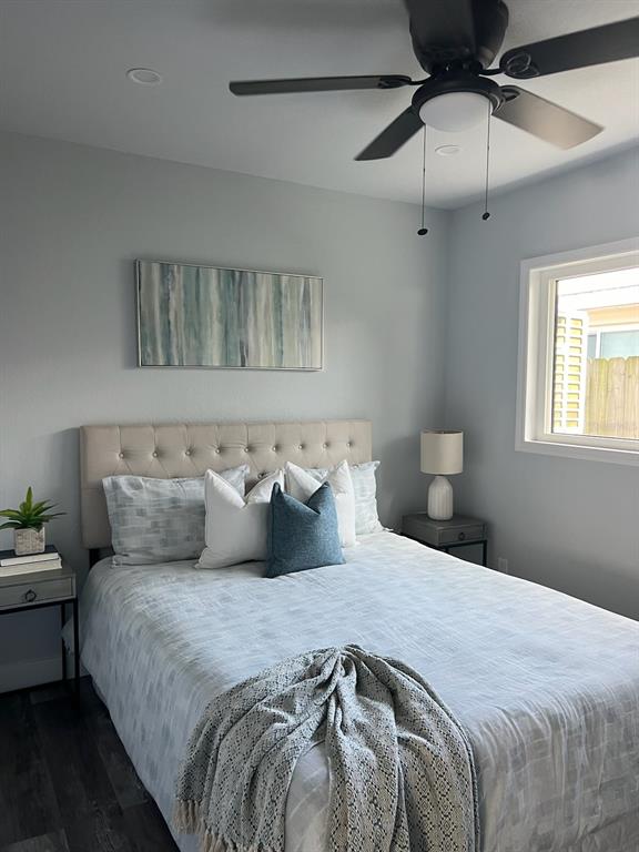 13246 4th Street East Madeira Beach, FL 33708 - Photo 18 of 23 a bedroom with a bed and window