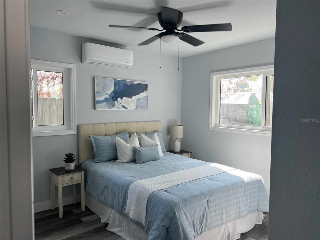 13246 4th Street East Madeira Beach, FL 33708 - Photo 23 of 23 a bedroom with a bed and a window