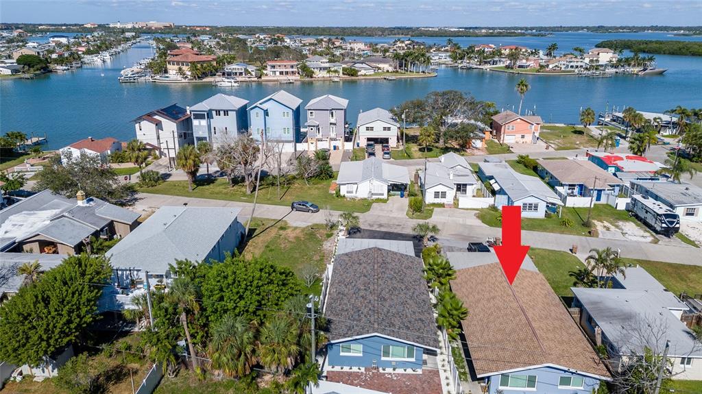 13246 4th Street East Madeira Beach, FL 33708 - Photo 5 of 23 an aerial view of lake and residential houses with outdoor space