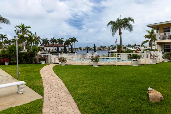 an aerial view of a house with garden space and street view