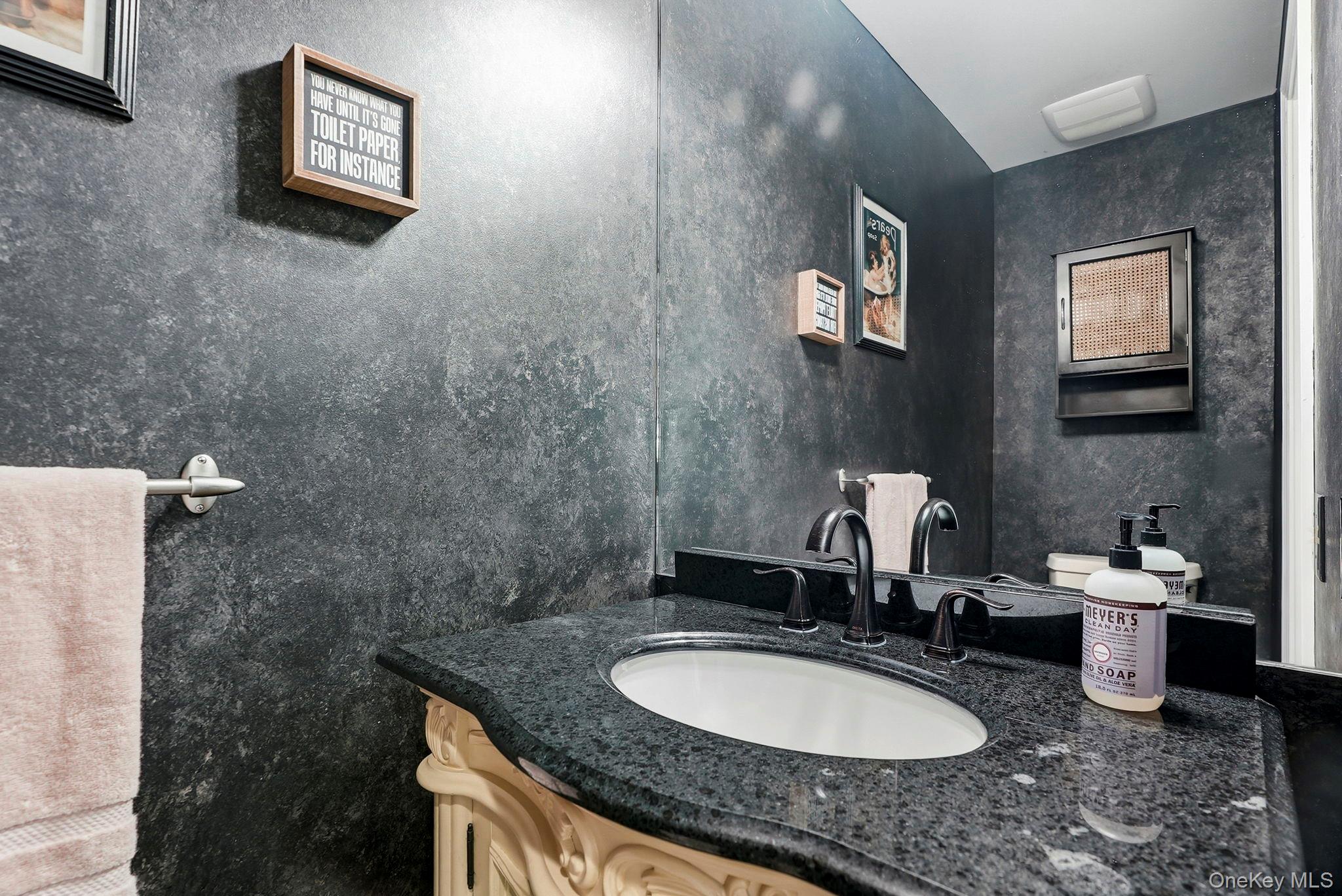 31 Ridge Road Cortlandt Manor, NY 10567 - Photo 17 of 39 Here's the main level guest powder room.