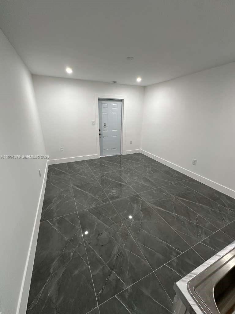 10825 Southwest 145th Place, Unit 2 Miami, FL 33186 - Photo 3 of 6 a view of an empty room