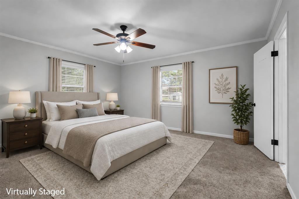 373 Ingred Street Waco, TX 76705 - Photo 13 of 39 a bedroom with a large bed and a chandelier