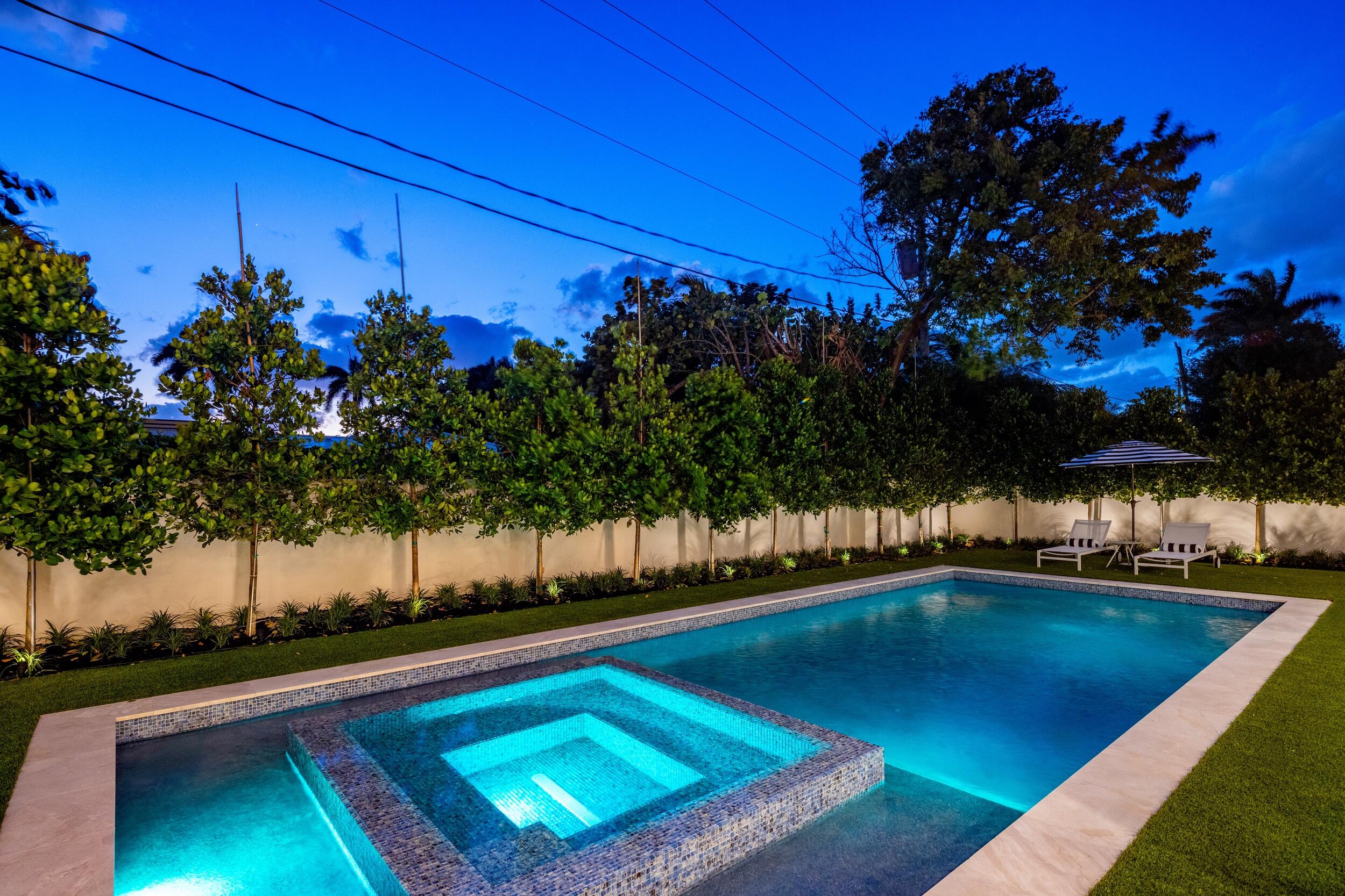 1351 Cocoanut Road Boca Raton, FL 33432 - Photo 7 of 101 a view of a swimming pool with an outdoor seating and a yard