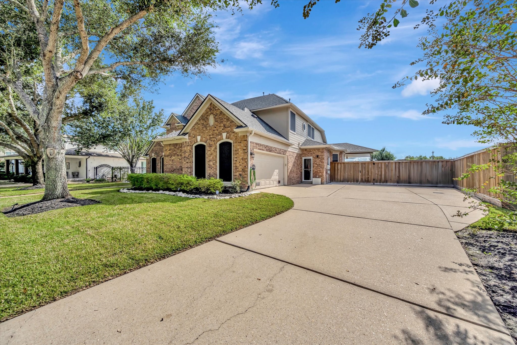 2847 Everett Drive Friendswood, TX 77546 - Photo 2 of 50 Spacious driveway leading to a convenient attached garage.
