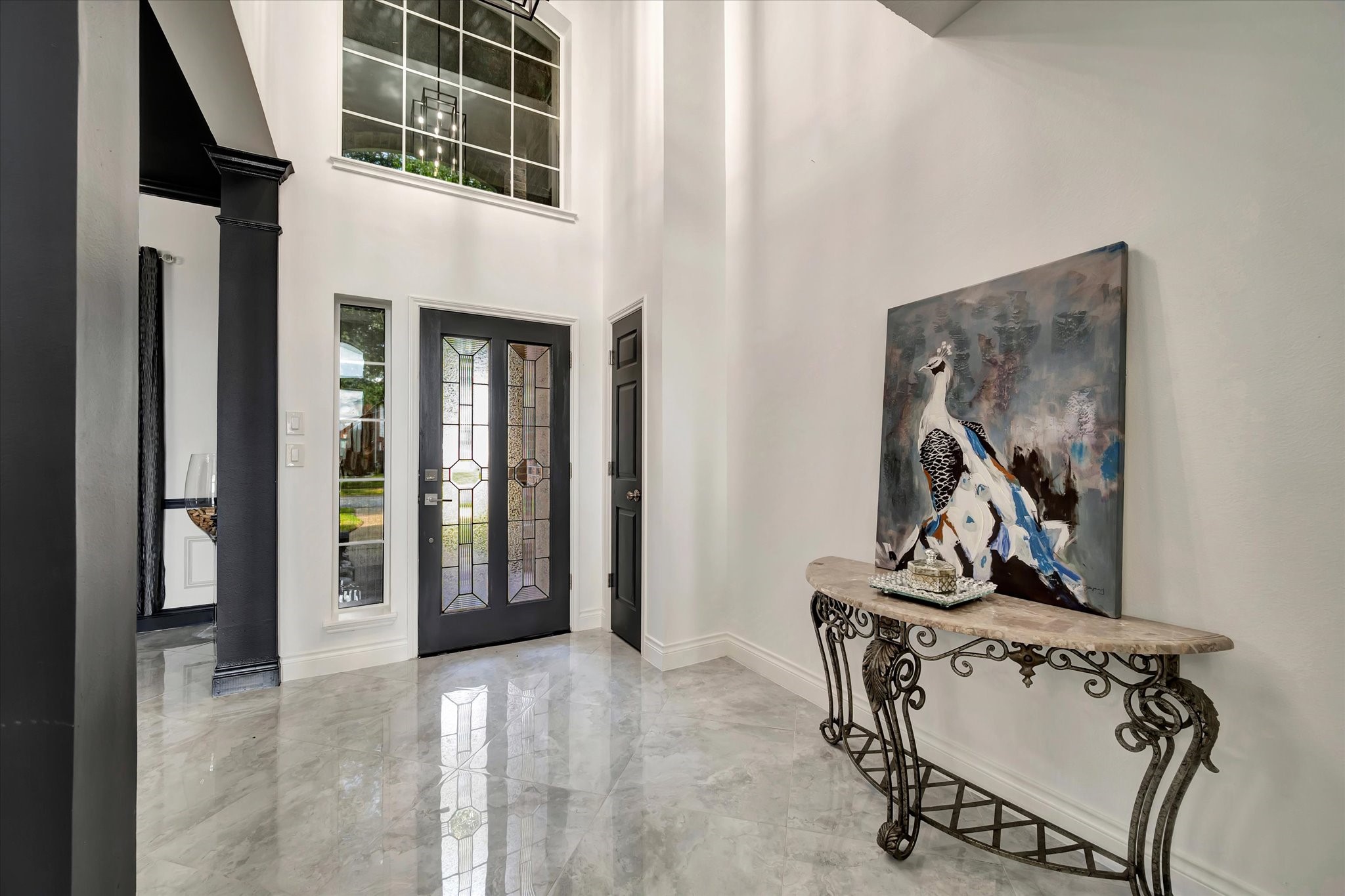 2847 Everett Drive Friendswood, TX 77546 - Photo 10 of 50 This elegant entryway features high ceilings and a large window, allowing plenty of natural light.