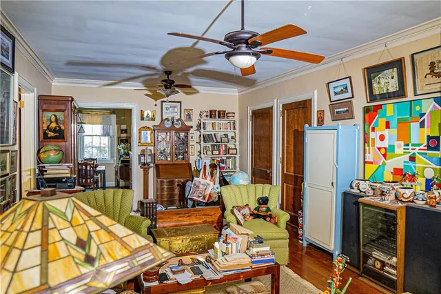a view of a livingroom with furniture and a flat screen tv