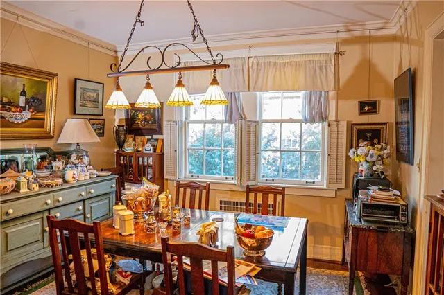 a view of a dining room and livingroom with furniture window and outside view