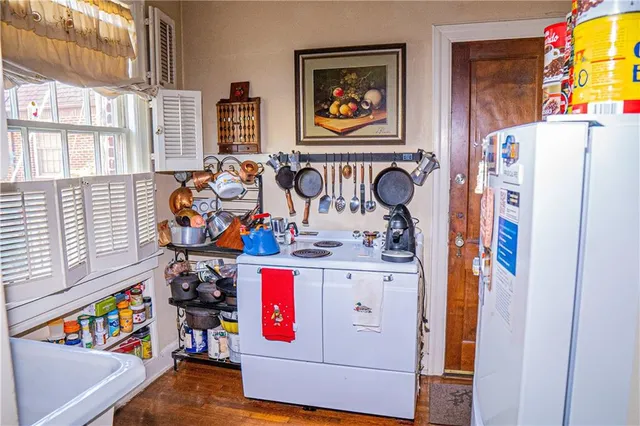 a view of an entryway with wooden floor and furniture