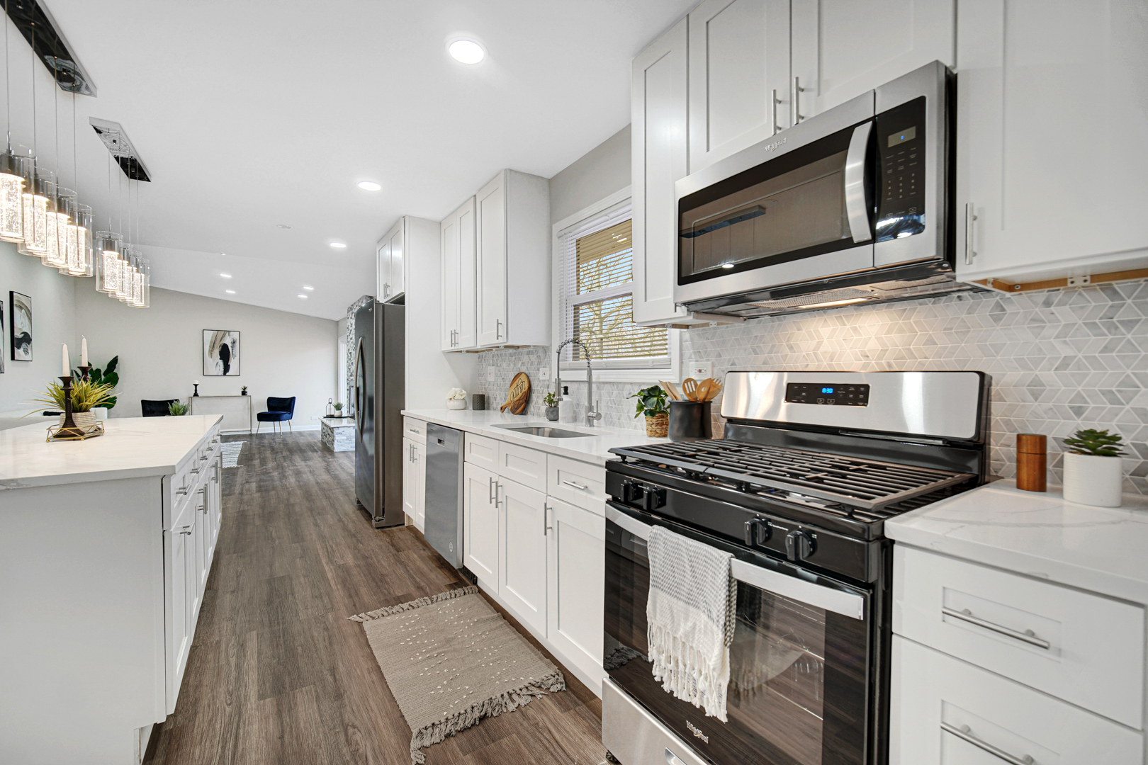 30 Cornwall Drive Crete, IL 60417 - Photo 11 of 44 a kitchen with stainless steel appliances a stove a microwave and cabinets