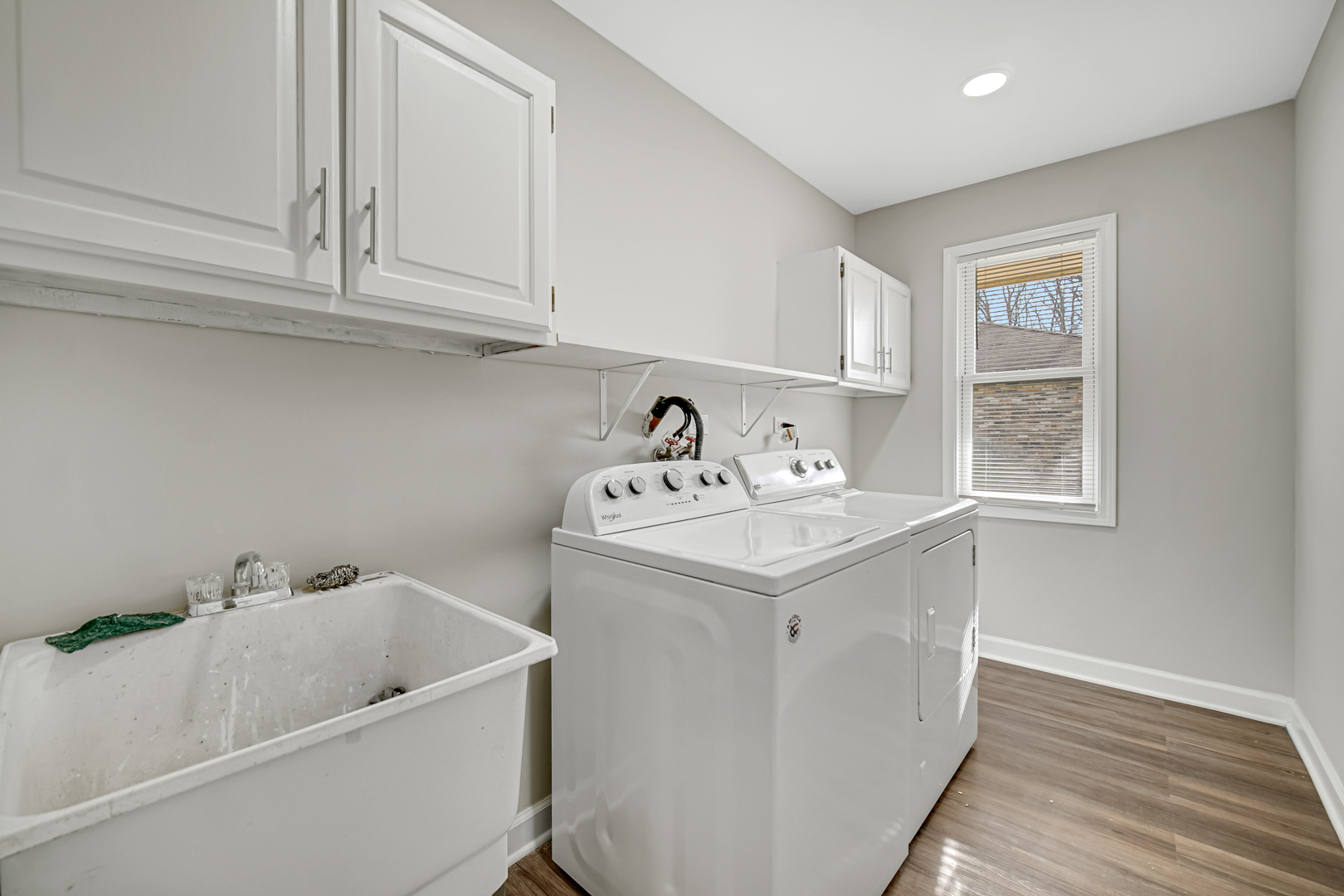 30 Cornwall Drive Crete, IL 60417 - Photo 15 of 44 a utility room with a sink a window and cabinets