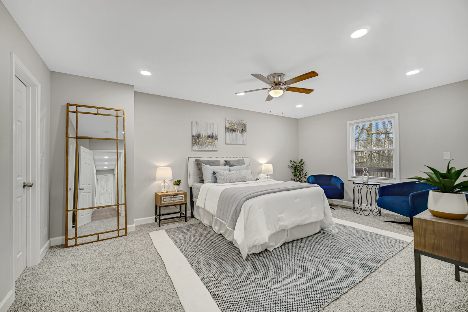 30 Cornwall Drive Crete, IL 60417 - Photo 19 of 44 a spacious bedroom with a bed and a chandelier