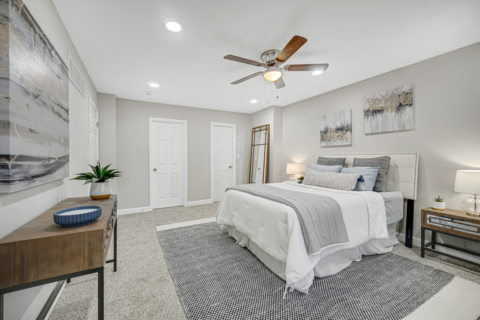 30 Cornwall Drive Crete, IL 60417 - Photo 20 of 44 a spacious bedroom with a bed a couch and potted plant