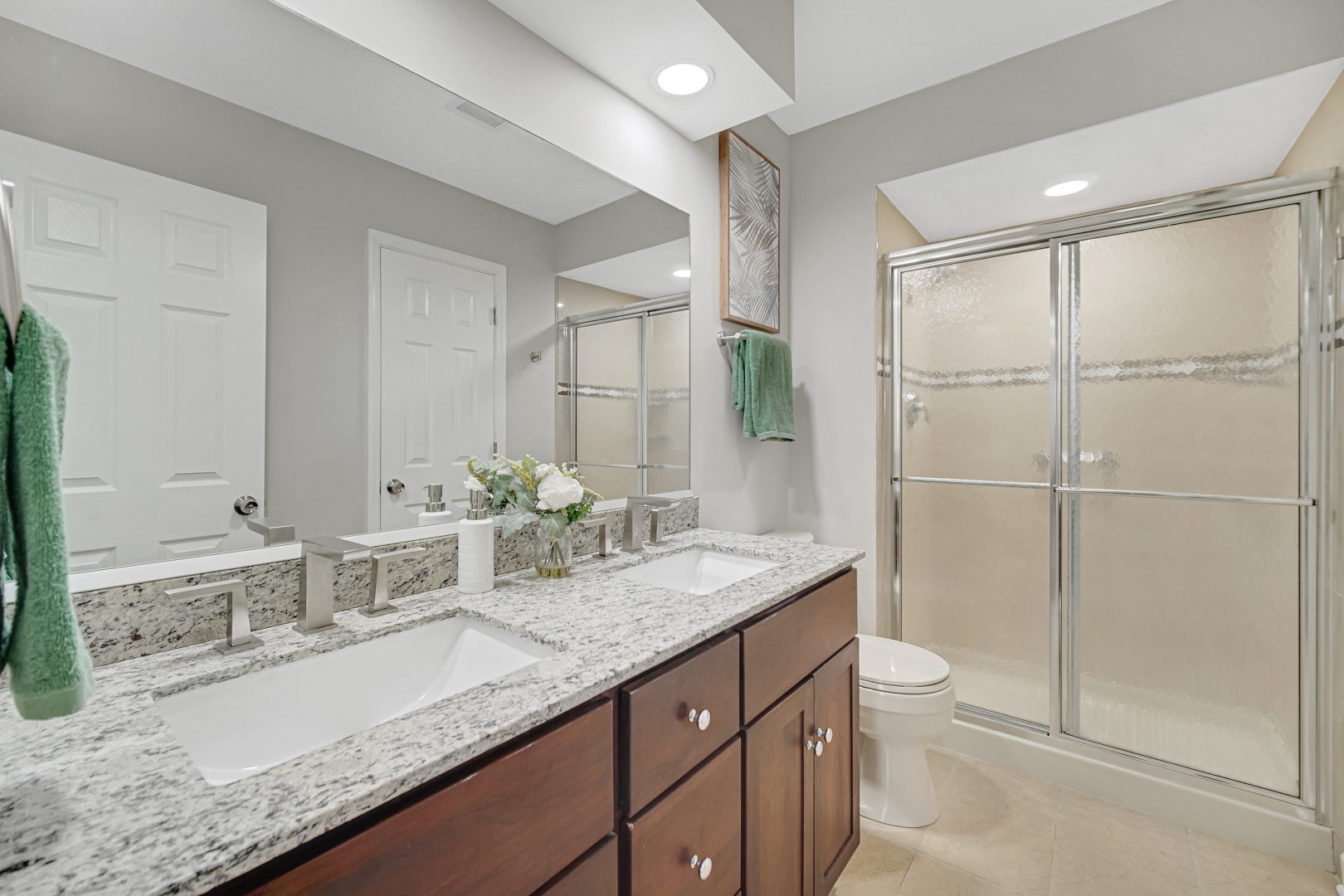 30 Cornwall Drive Crete, IL 60417 - Photo 22 of 44 a bathroom with a granite countertop sink a toilet and shower