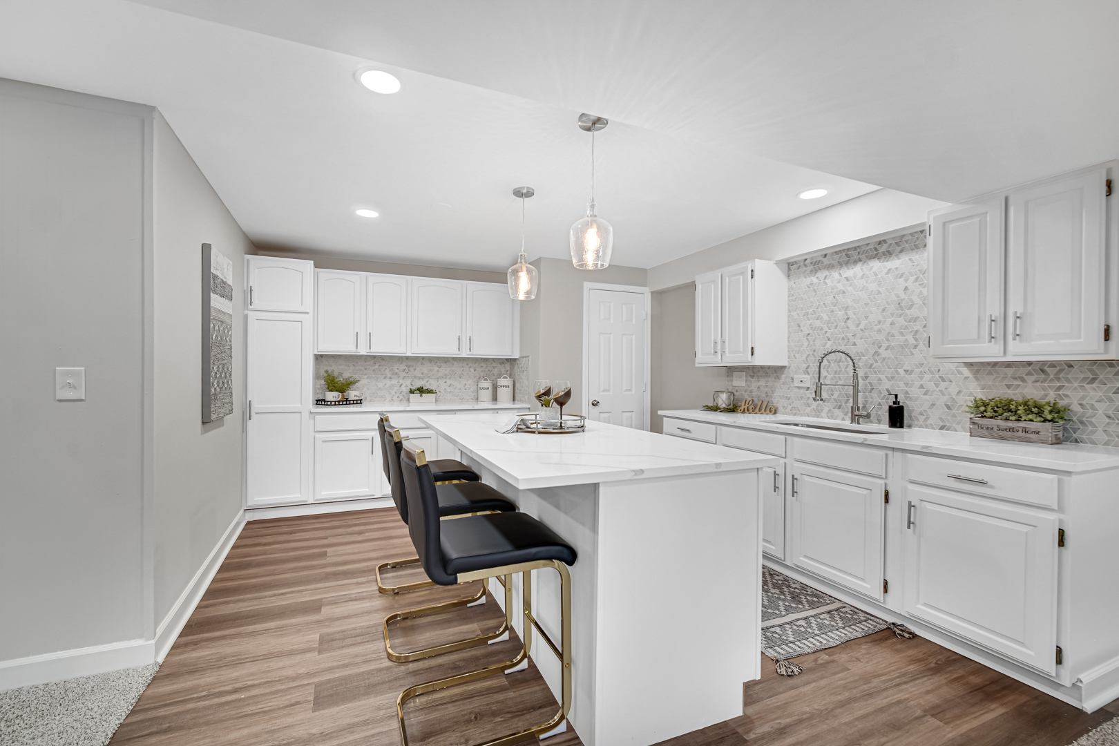 30 Cornwall Drive Crete, IL 60417 - Photo 27 of 44 a kitchen with white cabinets stove and white stainless steel appliances