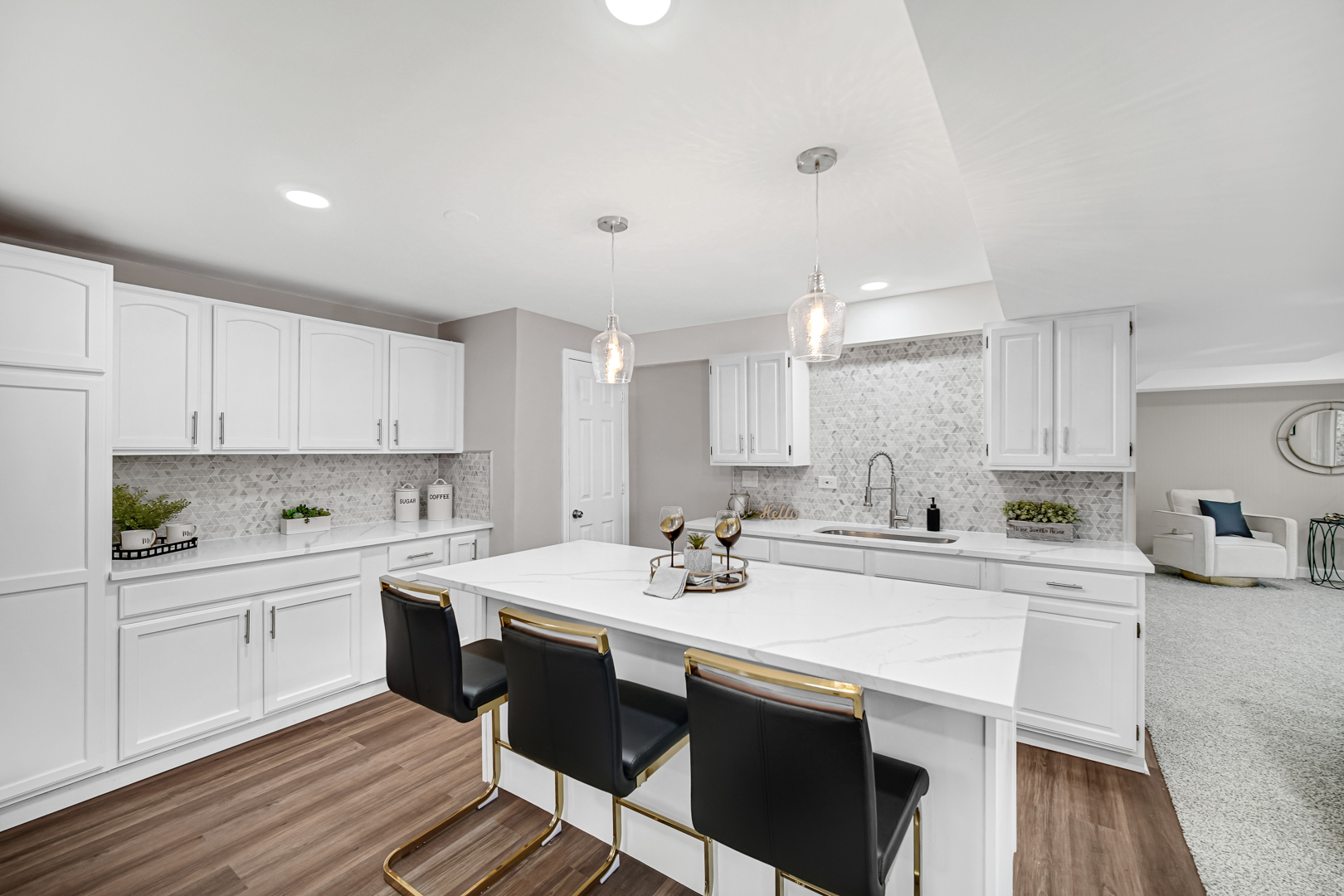 30 Cornwall Drive Crete, IL 60417 - Photo 28 of 44 a kitchen with a sink a stove a dining table and chairs