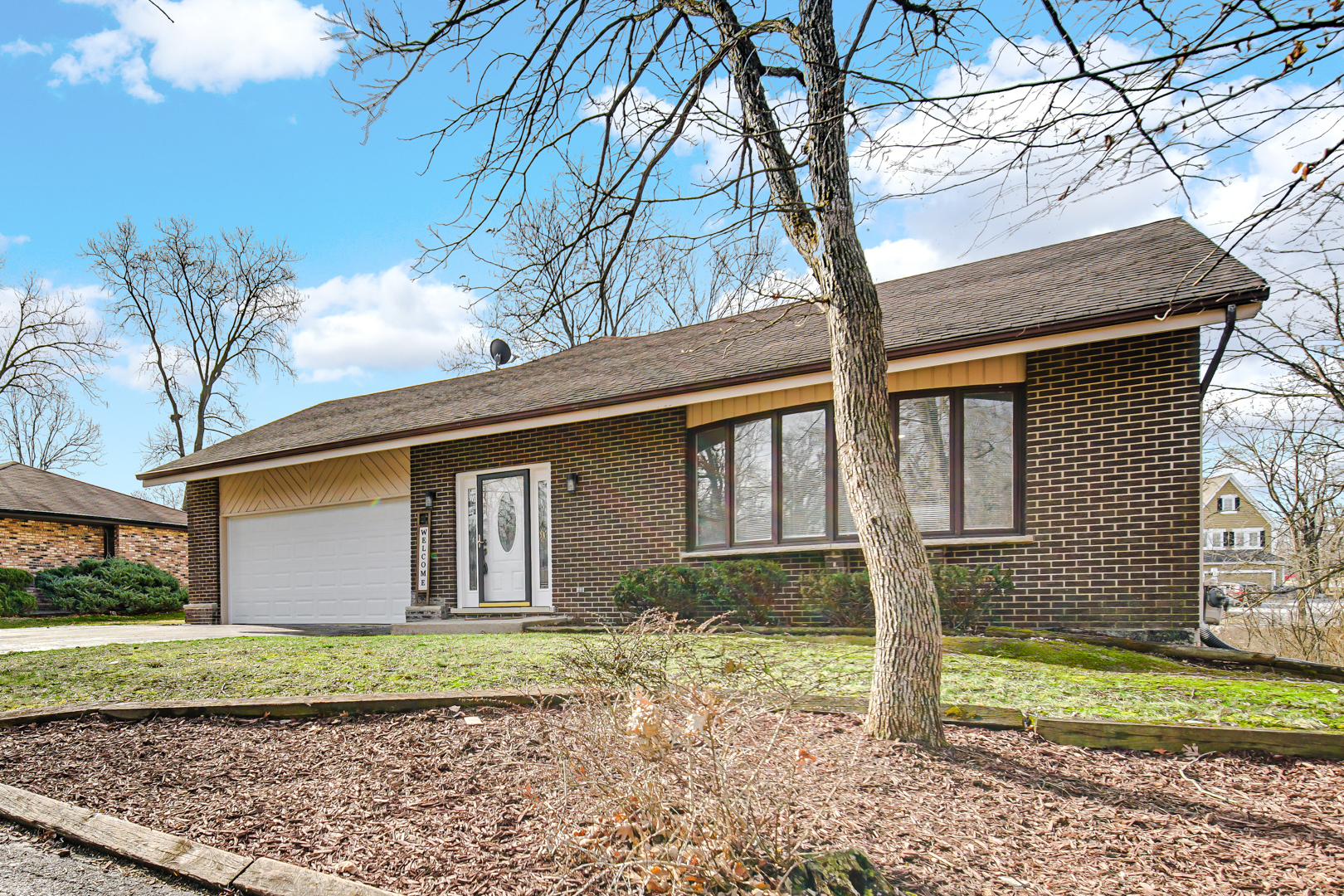 30 Cornwall Drive Crete, IL 60417 - Photo 3 of 44 a front view of a house with garden