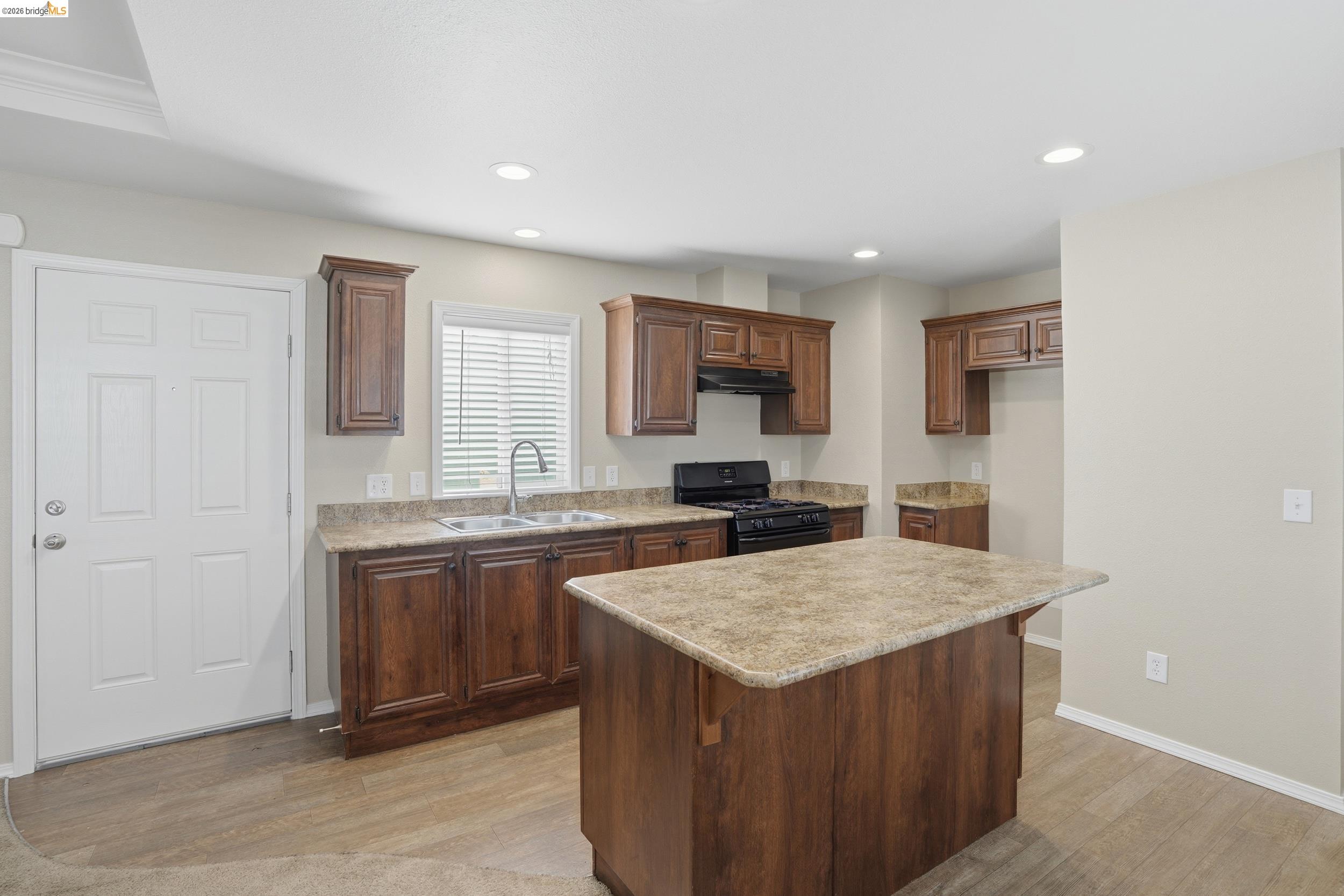 360 East Grant Line Road, Unit SPC 18 Tracy, CA 95376 - Photo 12 of 31 a kitchen with granite countertop a stove and a sink