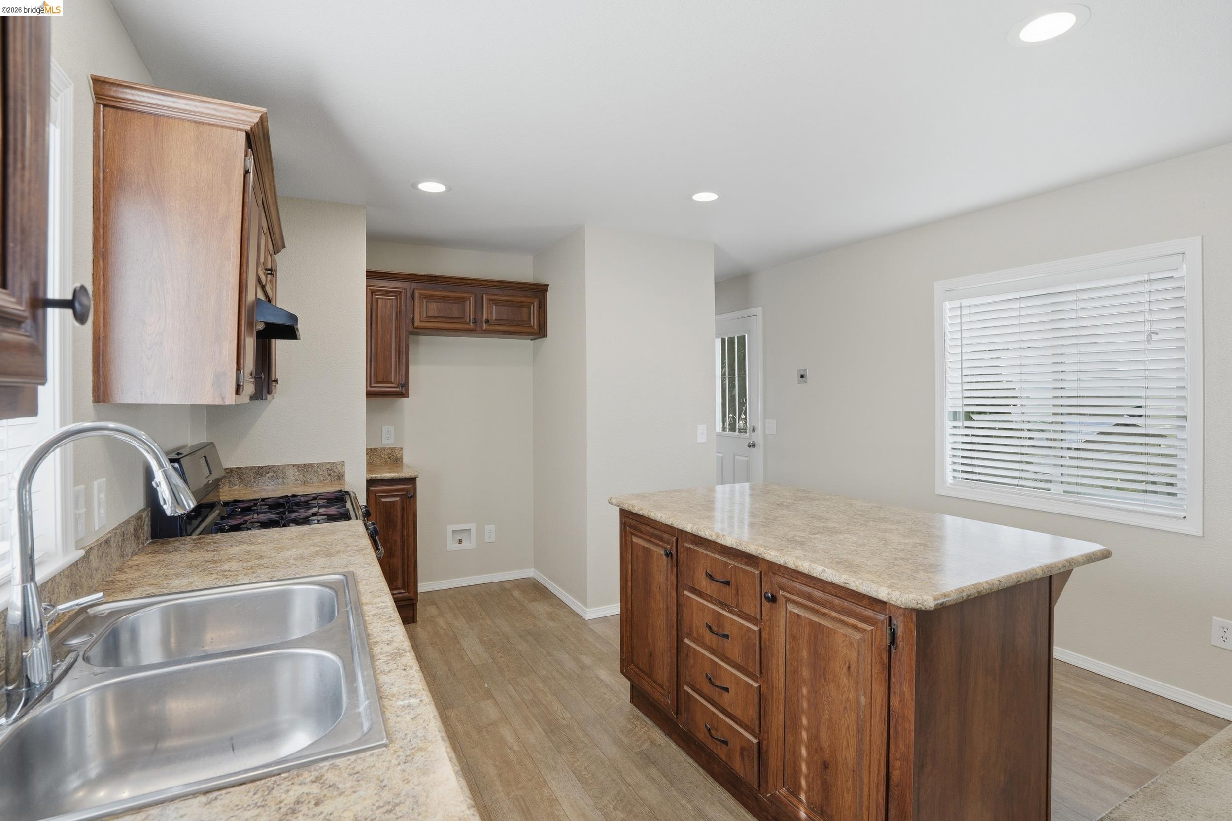 360 East Grant Line Road, Unit SPC 18 Tracy, CA 95376 - Photo 13 of 31 a kitchen with stainless steel appliances granite countertop a sink stove and cabinets