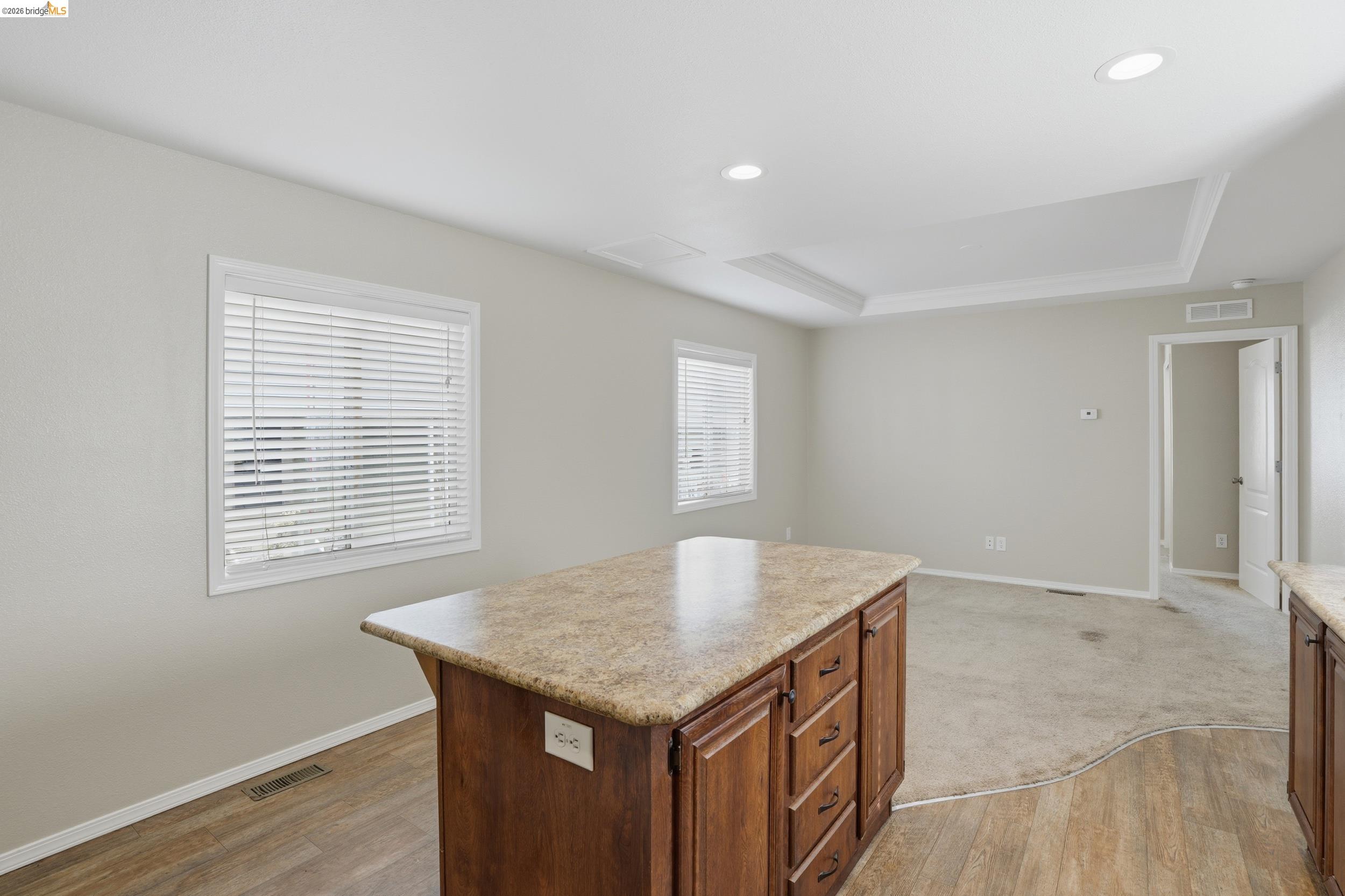360 East Grant Line Road, Unit SPC 18 Tracy, CA 95376 - Photo 14 of 31 a kitchen with a kitchen island hardwood floor and center island