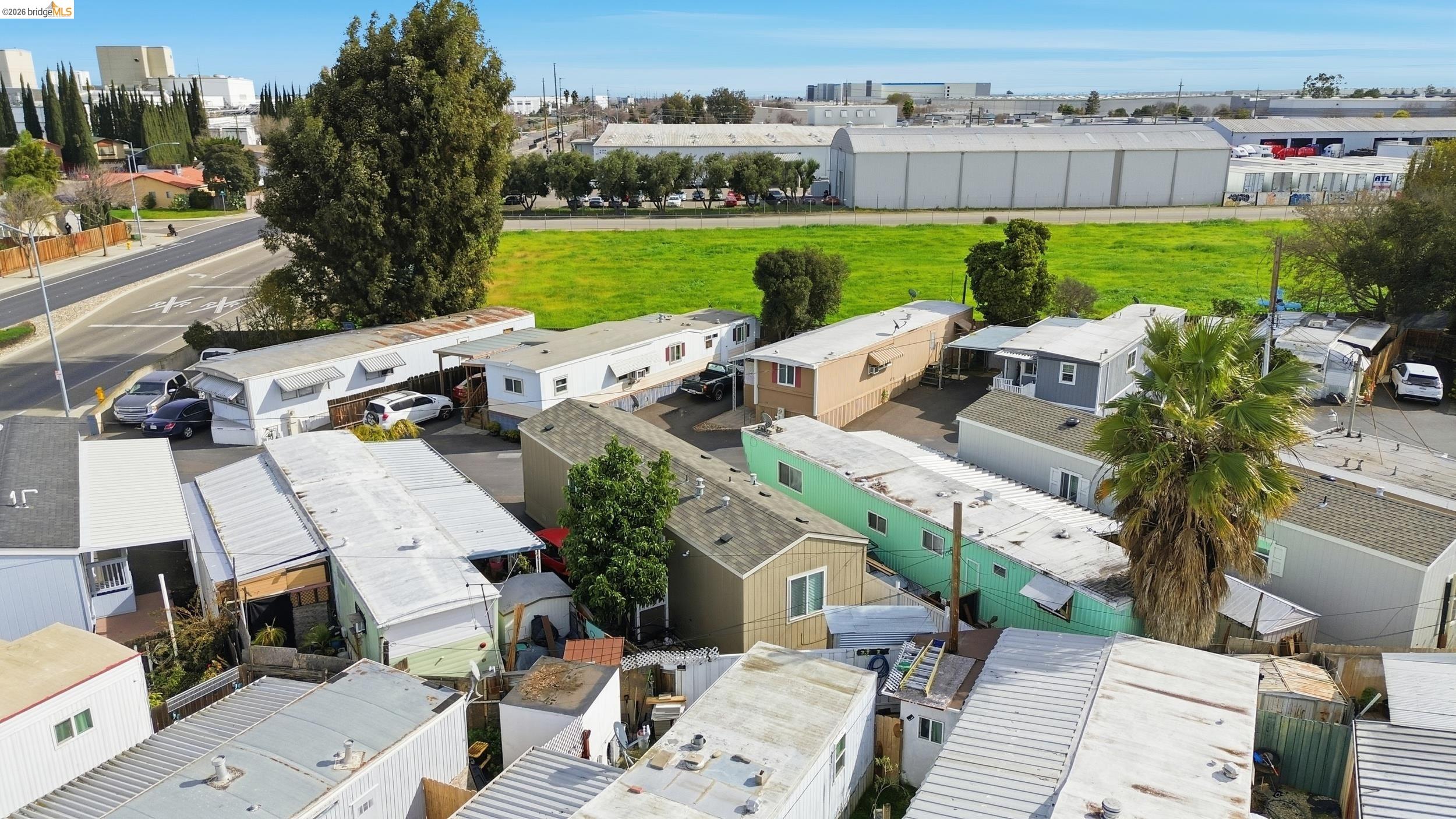 360 East Grant Line Road, Unit SPC 18 Tracy, CA 95376 - Photo 29 of 31 an aerial view of a house with a garden and lake view