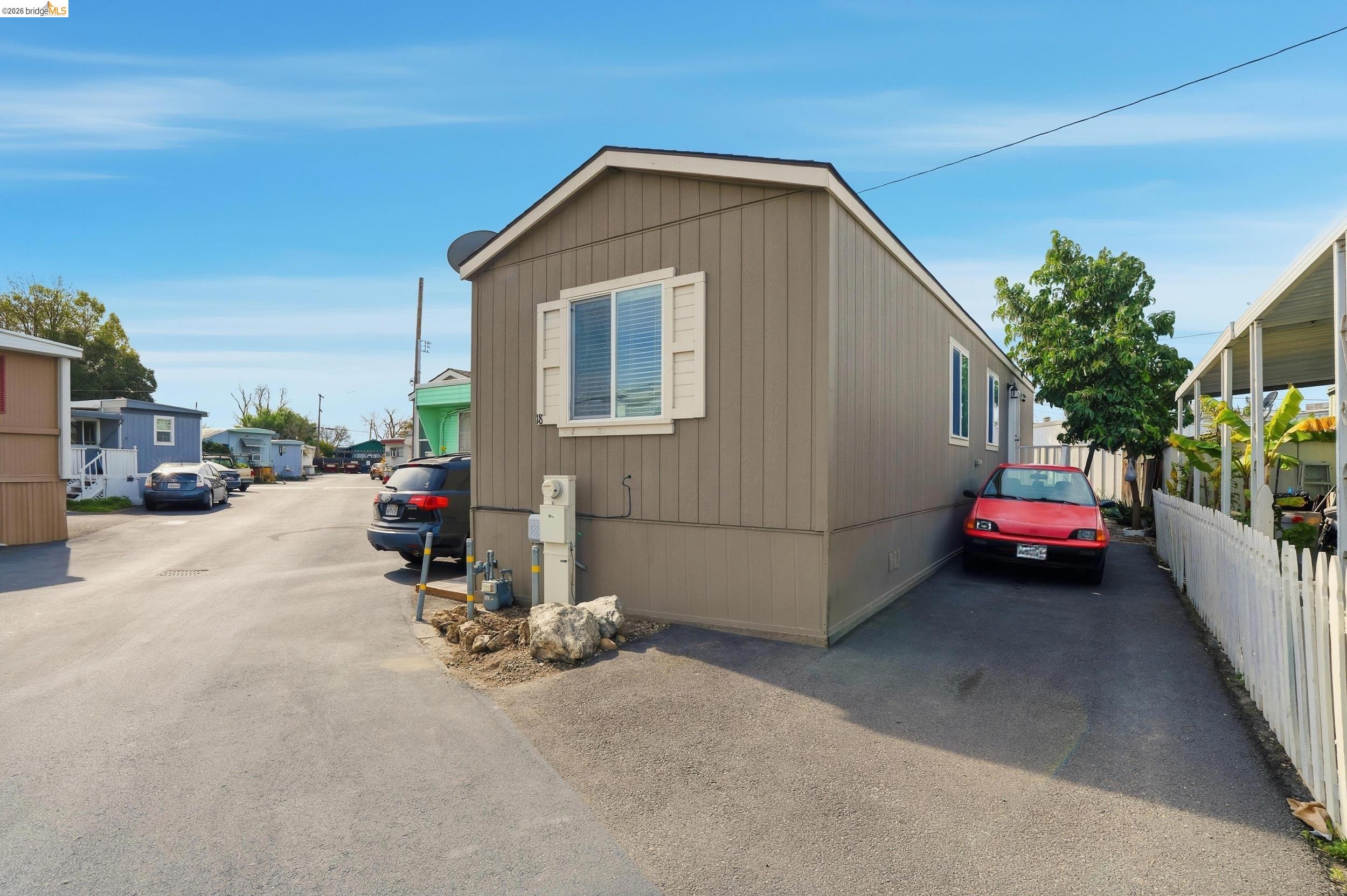 360 East Grant Line Road, Unit SPC 18 Tracy, CA 95376 - Photo 7 of 31 a car parked in front of a house