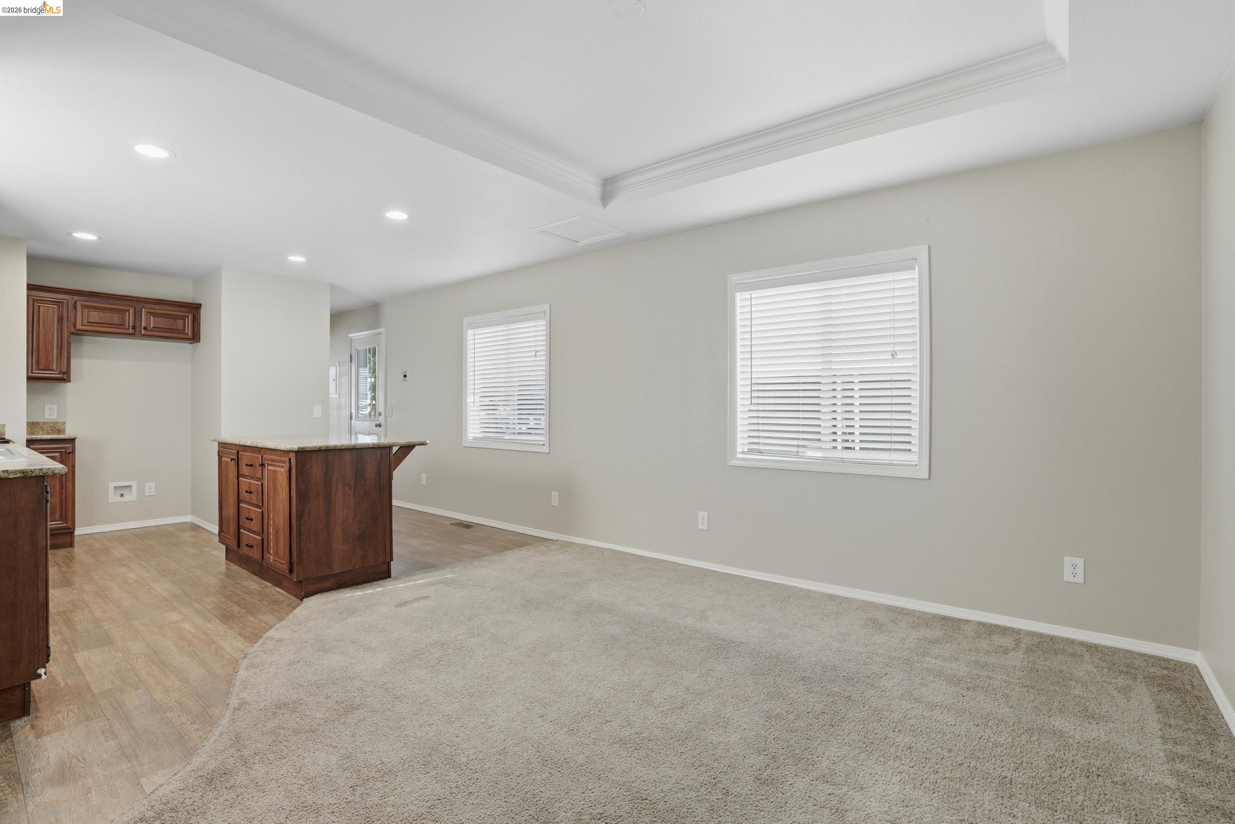 360 East Grant Line Road, Unit SPC 18 Tracy, CA 95376 - Photo 9 of 31 an empty room with windows and cabinet