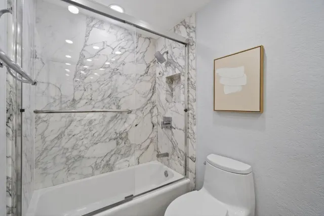 a view of game room with window and furniture