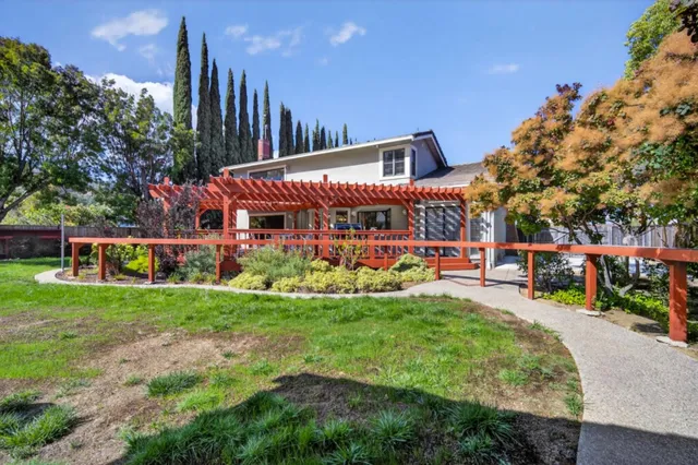 an aerial view of residential houses with city view