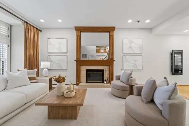 a dining room with wooden floor a chandelier a wooden table and chairs