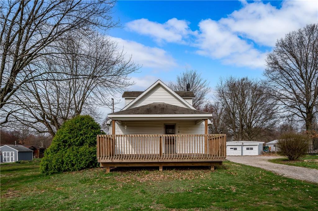 548 Meridian Road Renfrew, PA 16053 - Photo 1 of 27 a front view of a house with a garden and trees