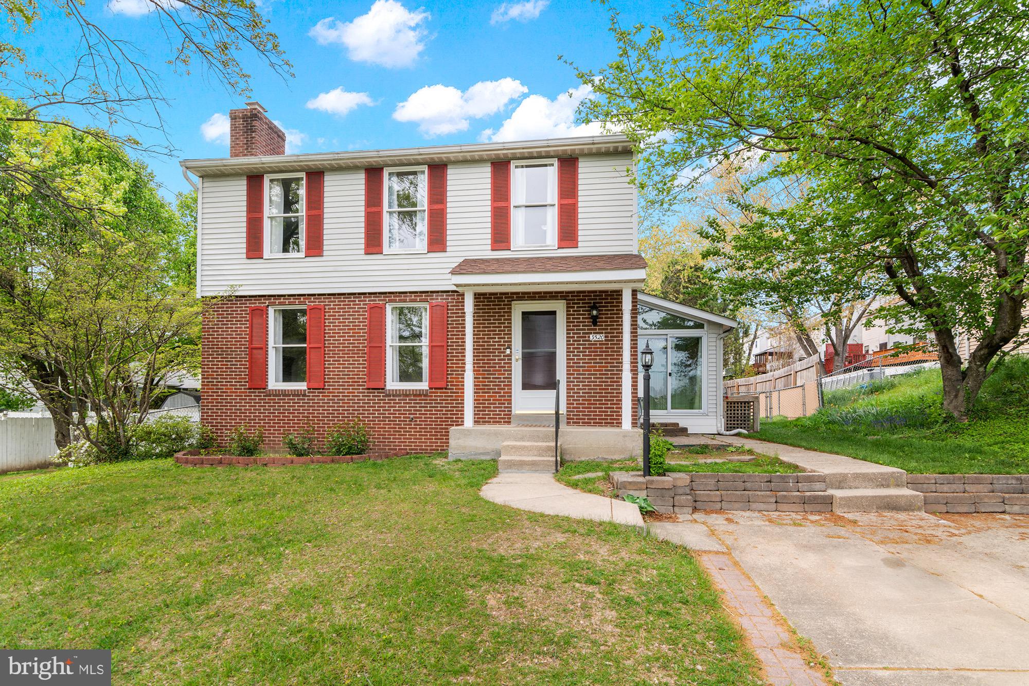 front view of a house with a yard