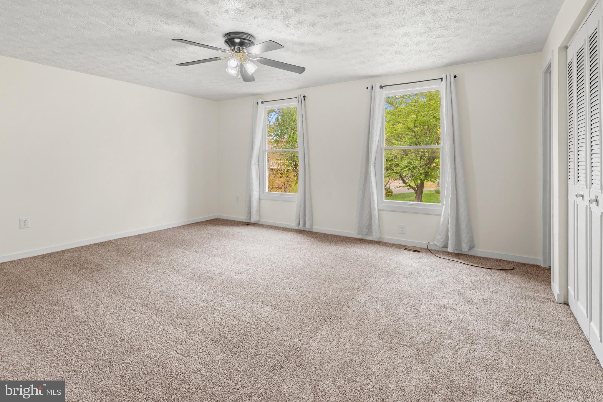 3520 Upton Road Baltimore, MD 21234 - Photo 22 of 39 an empty room with windows and fan
