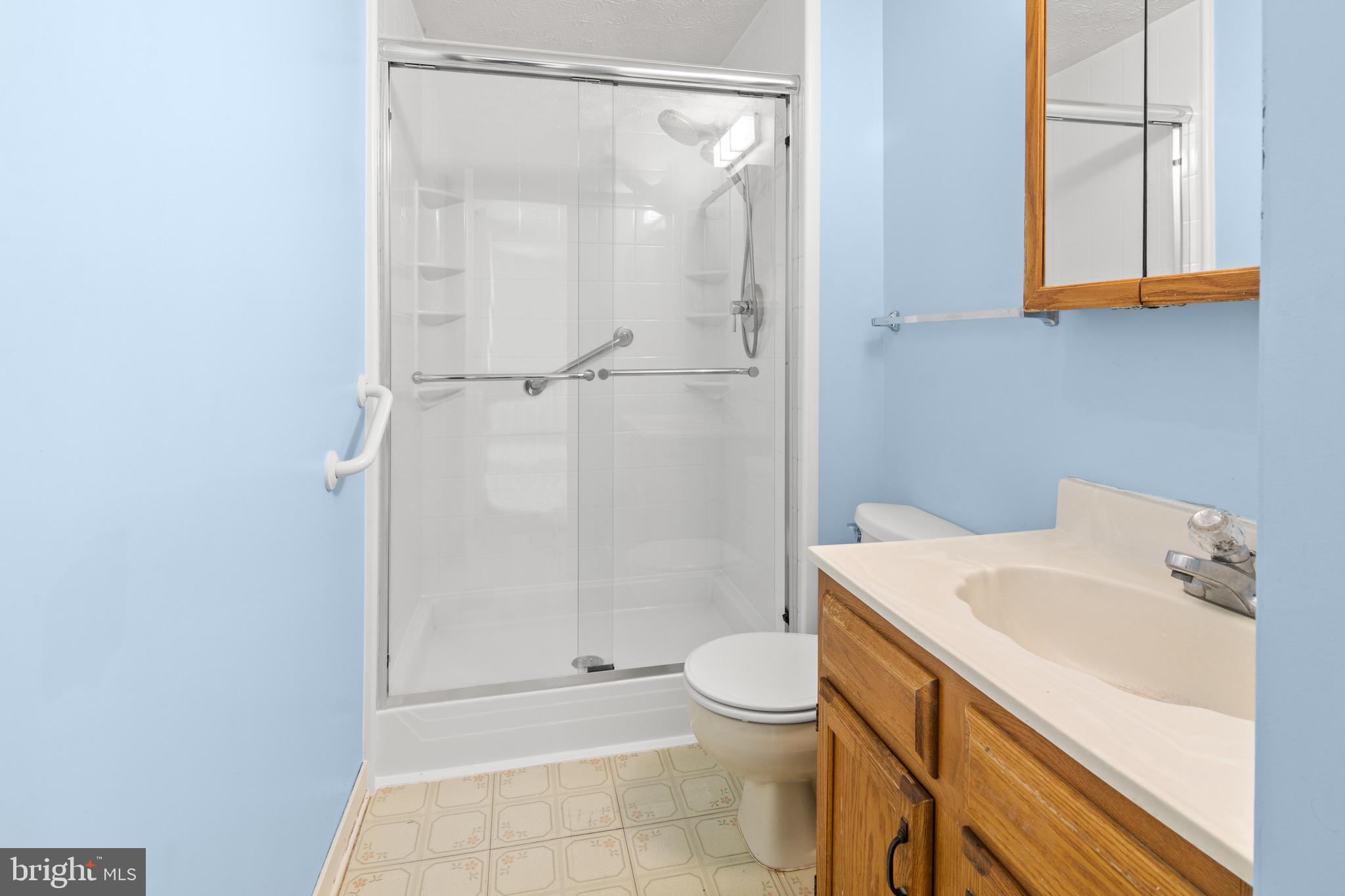 3520 Upton Road Baltimore, MD 21234 - Photo 24 of 39 a bathroom with a sink a toilet and shower