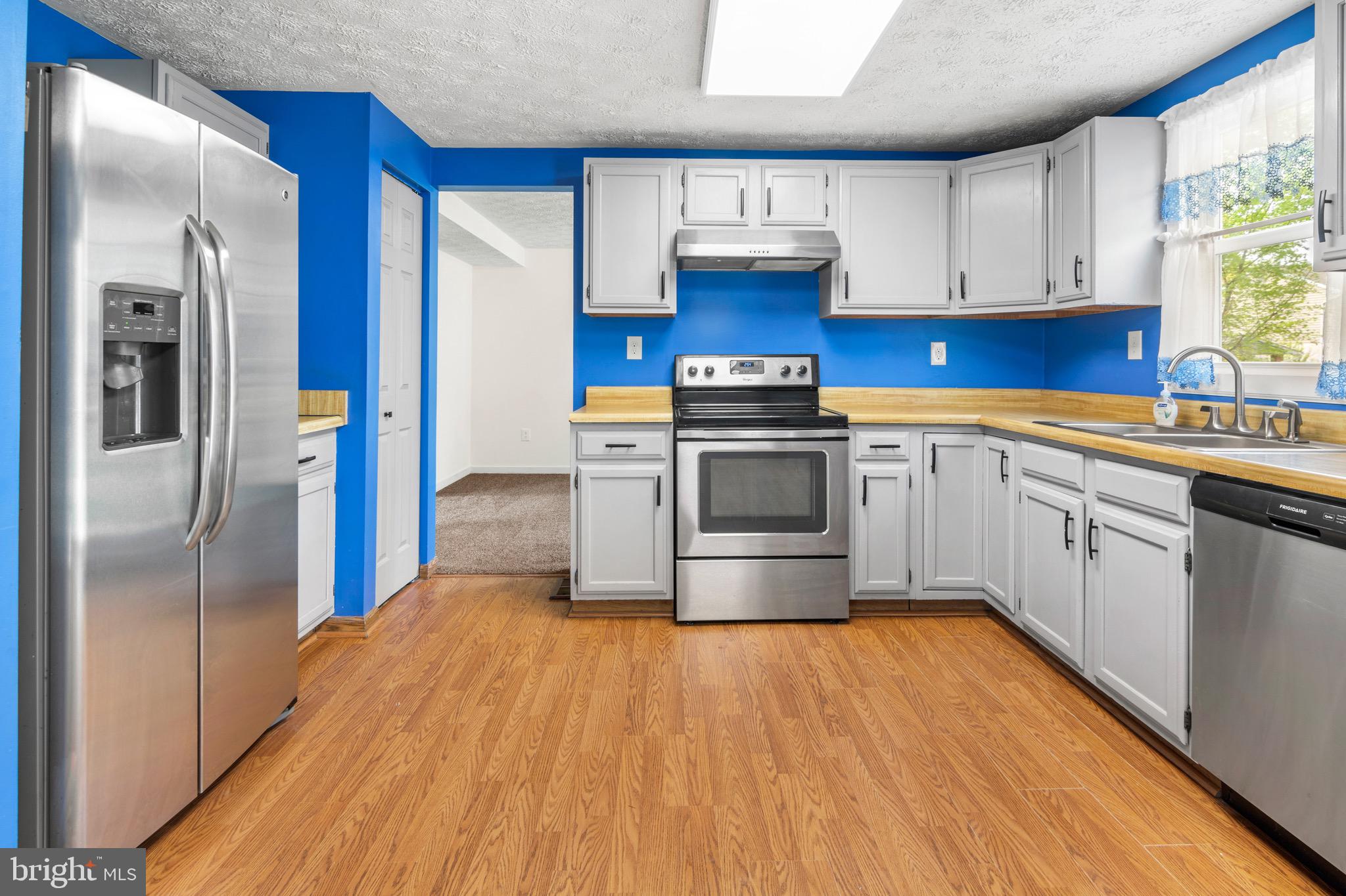 3520 Upton Road Baltimore, MD 21234 - Photo 9 of 39 a kitchen with stainless steel appliances granite countertop a stove a sink and a refrigerator