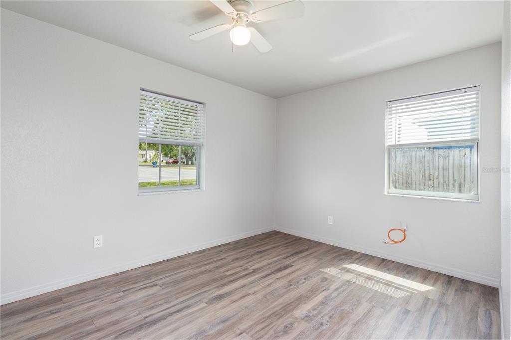 7208 Fair Oaks Street Spring Hill, FL 34606 - Photo 15 of 25 wooden floor in an empty room with a window