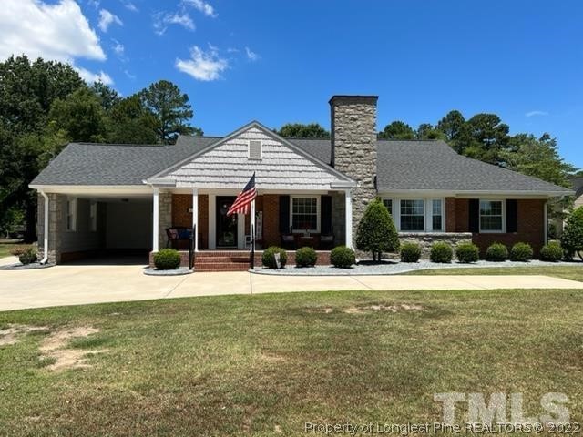 406 Old Post Road Erwin, NC 28339 - Photo 1 of 30 a front view of a house with a garden