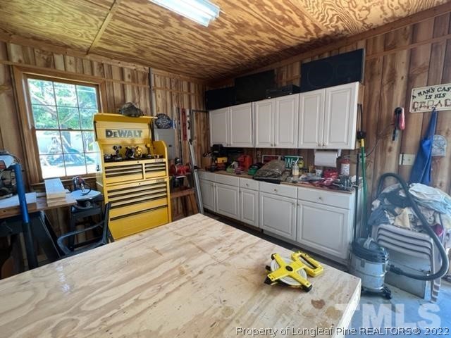 406 Old Post Road Erwin, NC 28339 - Photo 17 of 30 a bedroom with a bed and wooden floor
